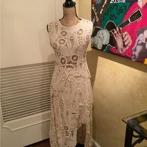 Asymmetric scalloped crochet top and skirt set.